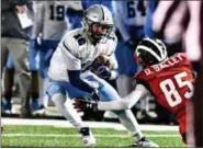  ?? TORREY MCNEAL — FOR THE NEWS-HERALD ?? Kenston quarterbac­k Jon Tomcufcik tries to elude a Columbus Eastmoor defender Nov. 23 during the Bombers’ 40-7 Division III state semifinal win.
