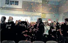  ?? LAURA BARTON/POSTMEDIA NEWS ?? Students at Jean-Vanier secondary school cheer and reach for the confetti flying through the air moments after the announced school board name change for what was once Conseil scolaire de district catholique Centre-Sud.
