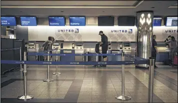  ?? JOHN TAGGART / THE NEW YORK TIMES ?? A United Airlines check-in counter at LaGuardia Airport in New York. Dr. David Dao’s lawyer, Thomas Demetrio, dismissed the Chicago police report out of hand. “It’s utter nonsense,” he said in a statement. “Consider the source.”