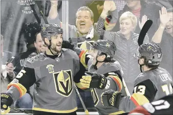  ?? JOHN LOCHER — ASSOCIATED PRESS ?? Vegas Golden Knights defenseman Deryk Engelland, left, celebrates after scoring against Arizona on Tuesday night.