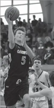  ??  ?? Oakwood Christian senior Matthew McDonough goes up for two points in the Eagles’ semifinal game against Knoxville Christian last Monday. The Eagles lost the game, 53-42. (Messenger photo/ Scott Herpst)