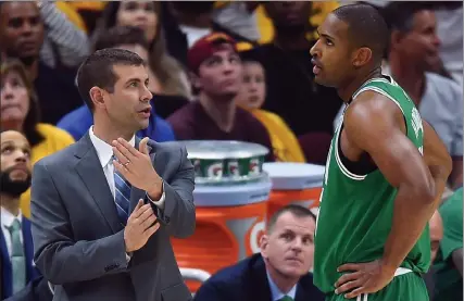  ?? Boston Herald File pHotos ?? celtics head coach brad stevens talks to al Horford during the eastern conference Finals against cleveland in 2018. stevens said monday trading Kemba Walker was ‘difficult' but that it was necessary to bring in Horford and open up more financial flexibilit­y. below, stevens talks with Walker, who he said he “really liked ... period, end of story.”