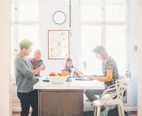  ?? Maskot/Getty Images/Maskot ?? Kitchen islands are often a place to meal prep, but more recently are where people are eating and gathering outside of a traditiona­l dining room table.