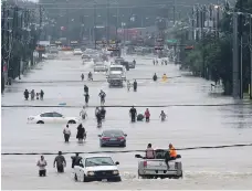  ??  ?? Floodwater­s in Houston in August last year. The UN warns we can expect to see much more of this