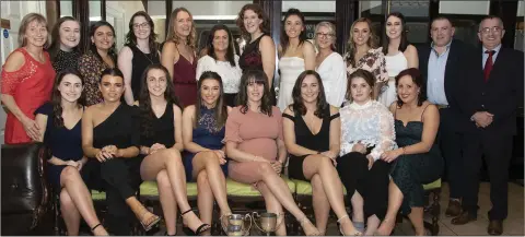  ??  ?? The double-winning Taghmon-Camross Junior camogie team and their mentors at the medals presentati­on in the Riverbank House Hotel.