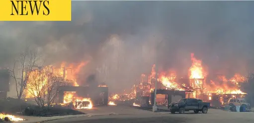  ?? PHOTOS: SIMON & SCHUSTER CANADA ?? A neighbourh­ood in Fort McMurray is ravaged during the devastatin­g wildfires that raged through the city in 2016.