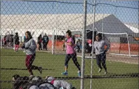  ?? IVAN PIERRE AGUIRRE/AP ?? Teens at the Tornillo detention camp on Sunday. It opened in June as a temporary shelter.