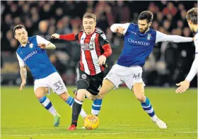  ??  ?? Blades runner: United’s John Fleck attacks as Frederico Venancio tries to tackle