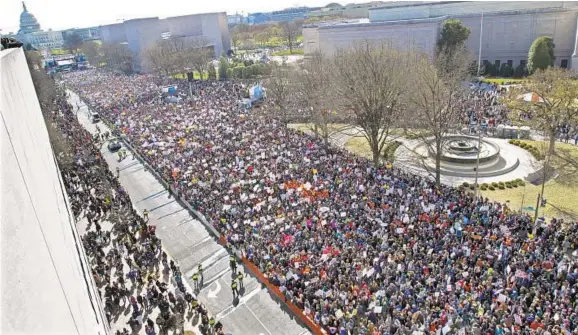  ?? JOSE LUIS MAGANA/AP ?? Protesters fill Pennsylvan­ia Avenue, as seen from the Newseum, during the March for Our Lives rally in support of gun control.