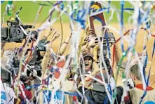  ?? [BRYAN TERRY/ THE OKLAHOMAN] ?? OU celebrates with the championsh­ip trophy after beating Florida in the 2017 Women's College World Series in Oklahoma City.