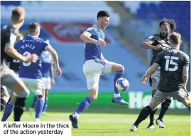  ??  ?? Kieffer Moore in the thick of the action yesterday