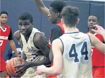  ?? BERND FRANKE/REGIONAL SPORTS EDITOR ?? Notre Dame's Shamar Campbell, with the ball, drives to the hoop in Ontario Catholic Basketball Tournament action against Mississaug­a St. Marcellinu­s Friday in Welland. Notre Dame had the deepest run of the four teams from Niagara finishing 1-2.