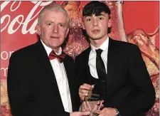  ??  ?? Brandon Bermingham receives his award for January from Drogheda Independen­t editor Hubert Murphy.