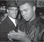  ?? FILE — THE ASSOCIATED PRESS ?? In this file photo, world heavyweigh­t boxing champion, Muhammad Ali, right, appears with Black Muslim Leader, Malcolm X, in New York. A Smithsonia­n Channel series, “The Lost Tapes: Malcolm X,” examining the life of civil right leader Malcolm X, follows...