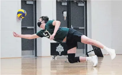  ?? DAVID PICKERING TRENT UNIVERSITY ATHLETICS ?? Excalibur left side Bryson Meadus dives for the ball at practice in the Trent University Athletic Centre.