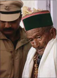  ??  ?? Shyam Saran Negi, 102, independen­t India’s first voter who has participat­ed in all elections since 1951, leaves after casting his vote in Kalpa, Himachal Pradesh, yesterday.