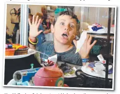  ??  ?? Alex Wolfenden, 9, is keen to get his hands on the yummy cakes.