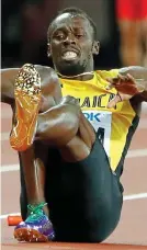  ??  ?? Sad end: Bolt collapses in last Saturday’s 4 x 100m final REUTERS