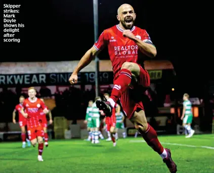  ?? ?? Skipper strikes: Mark Doyle shows his delight after scoring