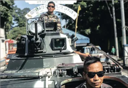  ?? PICTURE: EPA ?? Filipino soldiers man a military armoured personnel carrier following President Rodrigo Duterte’s declaratio­n of martial law in Cotabato City, Mindanao Island, southern Philippine­s, yesterday.