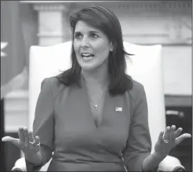  ?? AP Photo/Evan Vucci ?? Ambassador Haley: Outgoing U.S. Ambassador to the United Nations Nikki Haley speaks during a meeting with President Donald Trump in the Oval Office of the White House, Tuesday, in Washington.