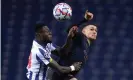  ?? Photograph: Quality Sport Images/Getty ?? Zaidu Sanusi of Porto competes for the ball with Manchester City’s Phil Foden.