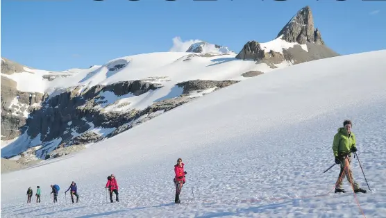  ?? JORG WILZ ?? After dropping their gear at Bow Hut, writer Michelle Gurtney and her hiking colleagues had an educationa­l session on safe glacier travel. It was early evening by the time they roped up, tested their crampons and hiked to the top of what’s known as the...