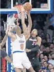  ?? FRANK FRANKLIN II/AP ?? Heat center Hassan Whiteside blocks a shot by Kyle O’Quinn of the Knicks on Friday.