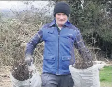  ??  ?? Anthony Moloney arriving at O’Mahony Park with a supply of hedging to be planted.