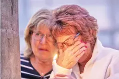  ??  ?? People attend a prayer and candleligh­t vigil at Rancho Bernardo Community Presbyteri­an Church in Poway. — AFP photo