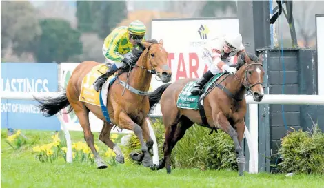  ??  ?? Close Up, outer, getting up to win the Group One Tarzino Trophy but he will struggle under 63.5kg tomorrow.
Picture / Trish Dunell