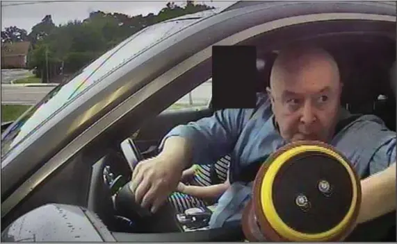  ?? COURTESY — U.S. DISTRICT COURT ?? Craig Clayton in a surveillan­ce camera still at a Navigant Credit Union location in Rhode Island on July 2, 2021. The feds say that at this moment, he was depositing a $190,000 cashiers check from a fraud victim into an account set up for the shell company “Providence Sanitizer Inc.”