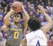  ?? ORLIN WAGNER — ASSOCIATED PRESS ?? Arizona State guard Tra Holder scored 29 points in a 95-85 victory at second-ranked Kansas on Sunday.