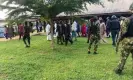  ?? Photograph: Reuters ?? Security forces guard Ondo governor Rotimi Akeredolu as he visits the church attack site.