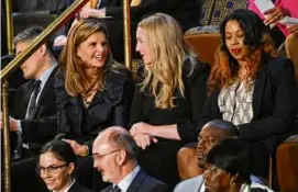  ?? MANDEL NGAN/AFP VIA GETTY IMAGES ?? Maria Shriver (left) was among those joining Jill Biden for the president’s State of the Union address.