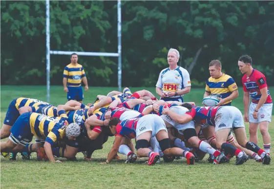  ?? Picture: MIKE BATTERHAM ?? Bond Pirates and Gold Coast Eagles get stuck into a scrum at Pizzey Park.