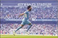  ?? Michael Regan / Getty Images ?? Manchester City’s Ilkay Gundogan celebrates after scoring against Aston Villa on Sunday.