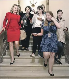  ?? Win McNamee Getty Images ?? REP. KATIE HILL talks with reporters following her final speech on the House f loor. She apologized to her family, mentors, friends and campaign volunteers.