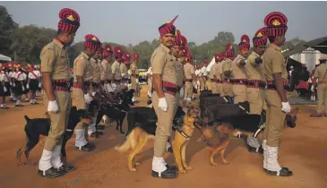  ?? GETTY IMAGES ?? The K-9 unit of the Karnataka State Police participat­es in a full dress rehearsal parade to celebrate India’s Republic Day in January in Bengaluru, home to India’s “silicon valley”.
