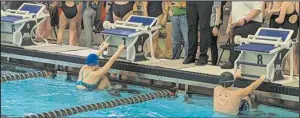  ?? ?? Lincoln Berg and Sophie Gilbertson prepare to start the 100 yard backstroke Submitted photo