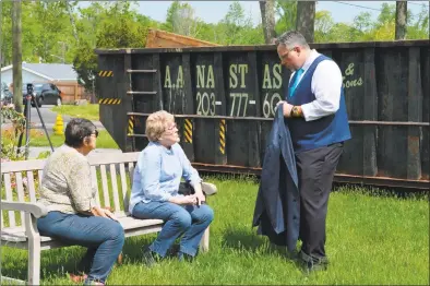  ?? Clare Dignan / Hearst Connecticu­t Media ?? Adele Volpe, center, talks with Hamden Mayor Curt B. Leng about the damage to her house on October Hill Road done by last year’s tornado. A dumpster full of debris and home wreckage sits behind them. Below, from left U. S. Sen. Richard Blumenthal, D-Conn.; U.S. Rep. Rosa DeLauro, D-Conn.; and Leng during a news conference to reintroduc­e the DEBRIS Act on Monday.