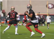  ?? Jeff Chiu / Associated Press ?? Rookie quarterbac­k Trey Lance’s smooth start in the 49ers’ training camp is cause for concern, but not by the 49ers. Jimmy Garoppolo (left) has also impressed this summer.