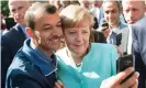  ??  ?? An asylum seeker takes a selfie with the German chancellor, Angela Merkel, in 2015. Photograph: Bernd von Jutrczenka/ AFP/Getty Images