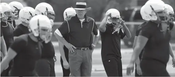  ?? / AP ?? STORY. Odessa Permian head coach Gary Gaines, center, watches his high school football players work out in Odessa, Texas, May 21, 2009. Gaines, coach of the Texas high school football team made famous in the book and movie “Friday Night Lights,” has died. He was 73. Gaines’ family says the former coach died in Lubbock after a long battle with Alzheimer’s disease.