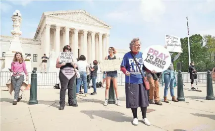  ?? MEGAN SMITH/USA TODAY ?? Demonstrat­ors rally outside the Supreme Court on Tuesday after a draft opinion was leaked.