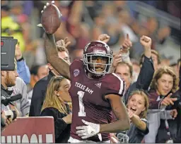  ?? Associated Press ?? Overtime rules changed: In this Nov. 24, 2018, file photo, Texas A&M wide receiver Quartney Davis (1) celebrates after catching a touchdown pass during an NCAA college football game against LSU in College Station, Texas.