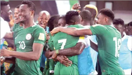  ??  ?? Super Eagles players celebratin­g their qualificat­ion for the 2018 World Cup in Russia last October