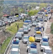  ??  ?? Vehicles stranded on the Jammu-srinagar highway that was closed due to landslides caused by rains, in Ramban, on March 7. PTI