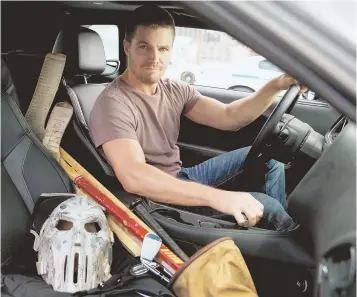  ??  ?? JONESING FOR A FIGHT: Stephen Amell, above, plays Casey Jones, who wears a hockey mask while fighting crime. Below, allies April O’Neil (Megan Fox), Donatello, Leonardo, Michelange­lo, Raphael and Jones (Amell), from left, plan tactics.
