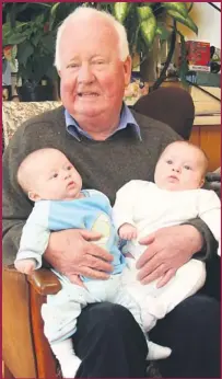  ??  ?? Ballylongf­ord publican and proud grand-dad, Alan Kennelly with twins, Fionn (left) and Cathal Byrne at the family home in 2008.